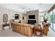 Comfortable living room with stone fireplace, neutral colors, and a relaxing ambiance, perfect for gatherings at 8224 Waterview Blvd, Lakewood Ranch, FL 34202