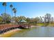Picturesque waterfront gazebo with scenic views, perfect for relaxation and enjoying the beauty of the water at 8224 Waterview Blvd, Lakewood Ranch, FL 34202