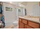 Bright bathroom featuring tiled floors, vanity with granite countertop, shower-tub combo, and a large mirror at 866 Placid Lake Dr, Osprey, FL 34229