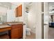 Bathroom featuring a vanity, toilet and doors leading to a bedroom and closet at 866 Placid Lake Dr, Osprey, FL 34229