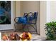 Cozy porch bench with a decorative pillow adjacent to a stained-glass front door with an elaborate crane design at 866 Placid Lake Dr, Osprey, FL 34229