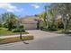 Charming single-story home with a paved driveway, tile roof, two-car garage, and professionally landscaped yard at 866 Placid Lake Dr, Osprey, FL 34229