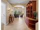 Inviting foyer featuring tile flooring, built-in shelves, and an open floor plan at 866 Placid Lake Dr, Osprey, FL 34229