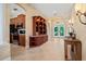 Welcoming foyer with tiled floors leads to the kitchen and decorative front door at 866 Placid Lake Dr, Osprey, FL 34229