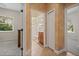 Hallway view showcasing access to the bathroom and bedroom, highlighting the home's functional layout and design at 866 Placid Lake Dr, Osprey, FL 34229