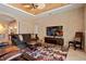 Cozy living room includes neutral walls, colorful rug and entertainment center at 866 Placid Lake Dr, Osprey, FL 34229