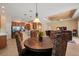 Open concept living space with a dining room, kitchen, and a living room with a tray ceiling at 866 Placid Lake Dr, Osprey, FL 34229