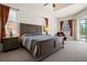 Spacious main bedroom with a large bed, two nightstands, and access to the pool area at 866 Placid Lake Dr, Osprey, FL 34229