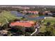 A beautiful aerial view of the golf course, the clubhouse and waterfront condominium homes at 8681 Daydream St, Sarasota, FL 34238