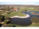 An aerial view of the beautiful golf course and surrounding neighborhood at 8681 Daydream St, Sarasota, FL 34238