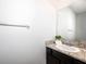 Stylish half bathroom featuring a granite countertop and modern fixtures at 8681 Daydream St, Sarasota, FL 34238