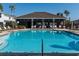 Inviting community pool with lounge chairs and covered seating for residents to enjoy at 8681 Daydream St, Sarasota, FL 34238