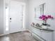 Bright foyer showcasing tile floors, natural light, and stylish decor at 8681 Daydream St, Sarasota, FL 34238