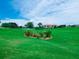 Beautiful golf course with serene lake views and meticulously manicured lawns, set against a backdrop of clear blue skies at 8681 Daydream St, Sarasota, FL 34238