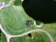 Aerial view of the golf course and lake that is part of this community's amenities at 8681 Daydream St, Sarasota, FL 34238