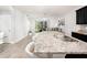 Open-concept kitchen with granite counters, stainless steel appliances, and island seating at 8681 Daydream St, Sarasota, FL 34238