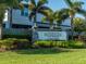 Promenade at Palmer Ranch sign surrounded by palm trees, lush greenery, and well-manicured landscaping at 8681 Daydream St, Sarasota, FL 34238
