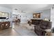 Comfortable living room with a seamless view of the adjacent dining area for easy entertaining at 8719 Gaillard Ave, North Port, FL 34287