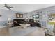 Inviting living room featuring comfortable seating, neutral paint, and plenty of natural light at 8719 Gaillard Ave, North Port, FL 34287