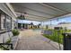 Inviting covered patio with comfortable seating, a stylish rug, and a view of the pool and backyard at 8719 Gaillard Ave, North Port, FL 34287