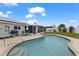 Backyard featuring a swimming pool, patio, outdoor seating and screened-in lanai at 8719 Gaillard Ave, North Port, FL 34287