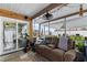 Relaxing screened porch with ceiling fans, and access to the backyard at 8719 Gaillard Ave, North Port, FL 34287