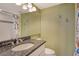 Granite countertop vanity in bath with tub and shower with colorful curtain at 8779 Midnight Pass Rd # 406H, Sarasota, FL 34242