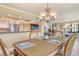 Open dining room view of kitchen and living room at 8779 Midnight Pass Rd # 406H, Sarasota, FL 34242