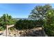Path to dock with surrounding foliage offers scenic views and a peaceful waterfront experience at 8779 Midnight Pass Rd # 406H, Sarasota, FL 34242