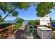 Well-maintained dock with lush greenery and calm waters perfect for boating at 8779 Midnight Pass Rd # 406H, Sarasota, FL 34242