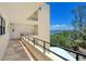 Hallway featuring tiled floors, multiple doors, and a scenic water view at 8779 Midnight Pass Rd # 406H, Sarasota, FL 34242