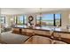 Kitchen with granite breakfast bar with view of dining room at 8779 Midnight Pass Rd # 406H, Sarasota, FL 34242