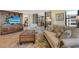 Cozy living room with tile flooring and a TV on a cabinet at 8779 Midnight Pass Rd # 406H, Sarasota, FL 34242
