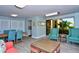 Inviting living room featuring comfortable seating, neutral walls, and access to a patio at 8779 Midnight Pass Rd # 406H, Sarasota, FL 34242
