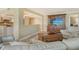 Relaxing living room showing the kitchen in the background at 8779 Midnight Pass Rd # 406H, Sarasota, FL 34242