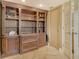 This living room features a beautiful custom built-in shelving system and stylish furnishings at 8779 Midnight Pass Rd # 406H, Sarasota, FL 34242