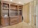 Spacious living room featuring a custom wood built-in bookcase, perfect for displaying decor at 8779 Midnight Pass Rd # 406H, Sarasota, FL 34242