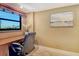 Home office with desk, chair, window, and serene natural light, great for productivity at 8779 Midnight Pass Rd # 406H, Sarasota, FL 34242