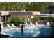 Community swimming pool surrounded by lounge chairs and lush landscaping at 8779 Midnight Pass Rd # 406H, Sarasota, FL 34242