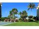 Shuffleboard court with benches surrounded by lush tropical landscaping and palms at 8779 Midnight Pass Rd # 406H, Sarasota, FL 34242
