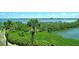 Enjoy the beautiful water views from this updated condo featuring gorgeous natural vegetation at 8779 Midnight Pass Rd # 406H, Sarasota, FL 34242