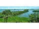 Incredible water views from this condo featuring gorgeous natural vegetation and a clear blue sky at 8779 Midnight Pass Rd # 406H, Sarasota, FL 34242