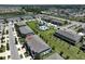 Aerial view showcases the community's layout with pool and surrounding green spaces at 9743 Pembrooke Pines Dr, Sun City Center, FL 33573