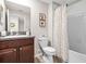 Bathroom showcasing vanity with granite countertops, toilet and tub with shower at 9743 Pembrooke Pines Dr, Sun City Center, FL 33573