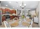 Open-concept kitchen and dining area with stainless steel appliances and stylish decor at 9743 Pembrooke Pines Dr, Sun City Center, FL 33573