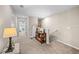 Hallway featuring carpeted floors, table with decor, and view of another room at 9743 Pembrooke Pines Dr, Sun City Center, FL 33573