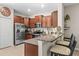 Well-equipped kitchen with stainless steel appliances and granite countertops at 9743 Pembrooke Pines Dr, Sun City Center, FL 33573