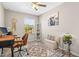 Home office area featuring a desk, modern chair, rug and decor at 9743 Pembrooke Pines Dr, Sun City Center, FL 33573