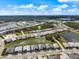 High angle bird's eye showing location with a lake view and the house's position inside the community at 10240 Beach Dune Dr, Englewood, FL 34223