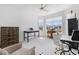 Bright bedroom featuring white walls, multiple windows, and neutral décor at 10240 Beach Dune Dr, Englewood, FL 34223